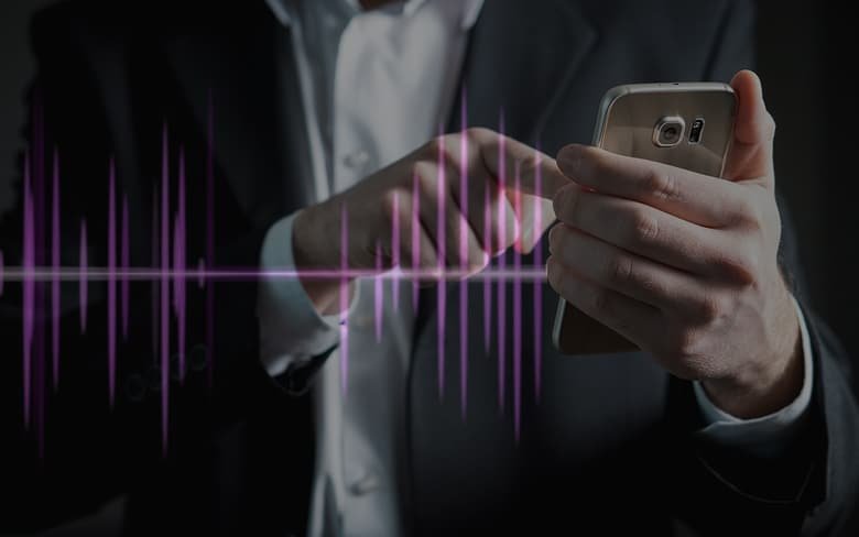 Man Touching on There Smartphone to use AI Powered Speech Tools
