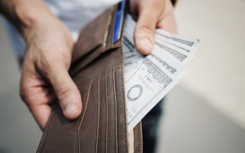 Man is Showing Cash in Wallet