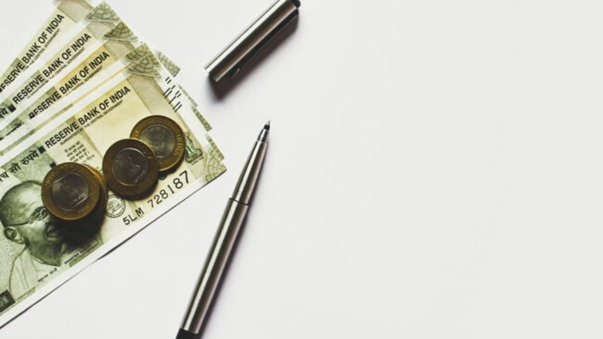 Indian Rupees And Pen