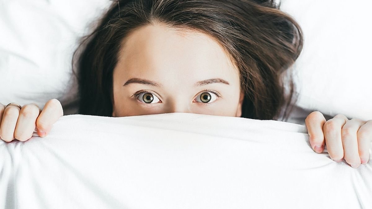 A Lady Seeing Out Of Blanket