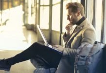 Man Working While Traveling