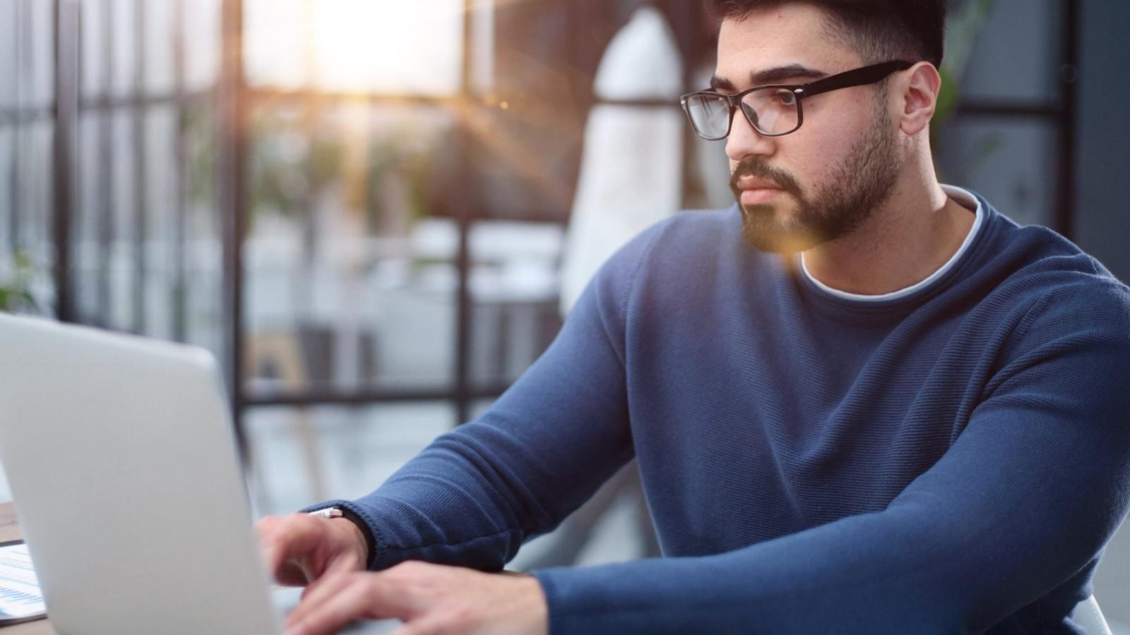 Young Man Working On a Laptop