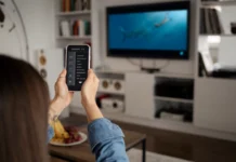 Woman Using Smart TV Remote