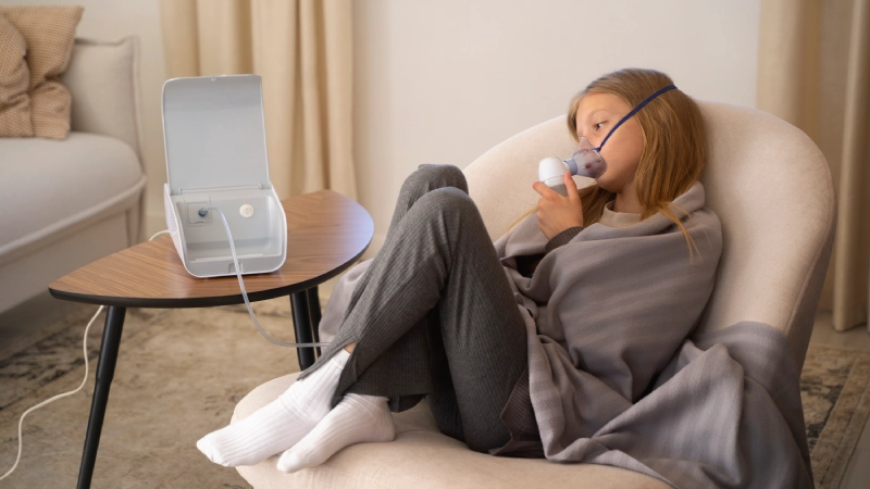 view teenage girl using nebulizer home respiratory health problems view-teenage-girl-using-nebulizer-home-respiratory-health-problems